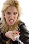 Front View Of Violent Young Woman Holding Nunchaku Stock Photo