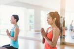 Asian Woman Doing Yoga Indoors Stock Photo