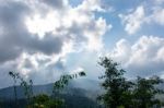 The Beauty Of The Sky When Light Hits The Clouds And Mountain Stock Photo