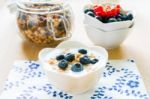 Healthy Breakfast With Granola, Yogurt And Fresh Fruits Stock Photo