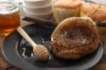 Wood Honey Dipper With Soft Cake Still Life Closeup Stock Photo