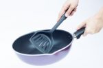 Hand With Non Stick Frying Pan On White Background Stock Photo