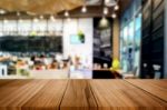 Selected Focus Empty Brown Wooden Table And Coffee Shop Or Resta Stock Photo