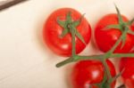 Fresh Cherry Tomatoes On A Cluster Stock Photo