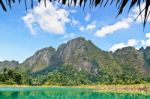 High Mountain Range Above The Green Lake Stock Photo