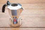 Metal Coffee Maker On Wooden Table Stock Photo