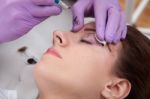 A Woman Getting Permanent Make Up Stock Photo