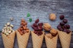 Concept For Homemade Various Nuts Ice Cream. Mixed Nuts In Waffl Stock Photo