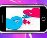 Two Hearts On Smartphone Showing Commitment Stock Photo