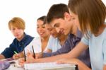 Teenage student Writing On book Stock Photo