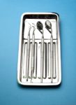 Dental Tools On Plate Stock Photo