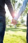 Hands Of A Couple Held Together Stock Photo