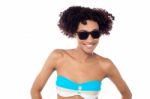 Smiling Curly Haired Bikini Model In Dark Shades Stock Photo