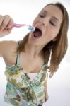 Woman Brushing Her Teeth Stock Photo