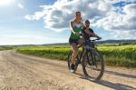 Happy Young  Couple On A Bike Ride In The Countryside Stock Photo