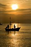 Fisherman Silhouette In Sea Stock Photo