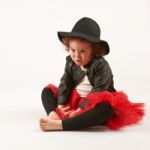 Little Girl Fashion Model With Black Hat Stock Photo