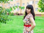 Beautiful Young Brunette In A Park Stock Photo