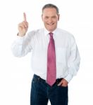 Businessman Pointing Upwards Stock Photo