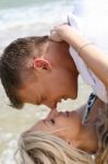 Couple Kissing At Beach Stock Photo