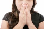 A Young Woman Praying With Her Hands Together On White Backgroun Stock Photo