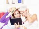 Happy Teenage Girls Having Fun Using Touchpad Stock Photo