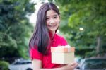 Portrait Of Thai Teen Beautiful Girl In Chinese Dress, Happy New Year And Open Box Gift, Smile And Very Happy Stock Photo