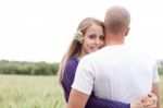 Beautiful Young Lady Hugging Her Husband Stock Photo