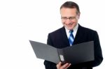 Smart Businessman Holding A Open File Stock Photo