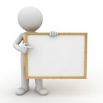 Figure Holding Blank Board Stock Photo