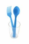 Blue Plastic Utensil In Glass Stock Photo