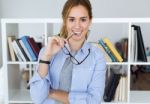 Beautiful Young Woman Looking At Camera At Home Stock Photo