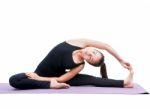 Portrait Of Asian Woman Wearing Black Body Suit Sitting In Yoga Meditation Position Isolated White Background Stock Photo