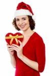 Pretty Smiling Santa Woman With Christmas Gift Stock Photo