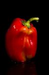 Red Bell Pepper On A Black Background Stock Photo