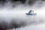 Boat Moored In Lake Mcdonald Near Apgar Stock Photo