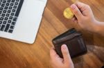 Hand With Golden Metal Bitcoin Crypto Currency Investment- Symbo Stock Photo