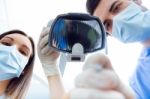 Cute Young Woman At The Dentist. Mouth Checkup Stock Photo