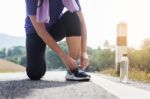 Cropped Shot Of Young Women Runner Tightening Running Shoe Laces Stock Photo