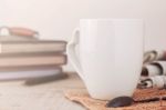 Cup And Book On Wooden Stock Photo