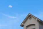 New Traditional Gable Roof  House Under Moon Sky Stock Photo