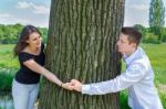 Young Attractive Caucasian Couple In Love Holding Hands Around T Stock Photo