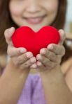 Closeup Heart Shape With Women's Hands In Vertical Stock Photo