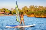 Little Girl Winsurfing On Ada Bojana, Montenegro Stock Photo