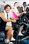 Three People Doing Cardio Training Stock Photo