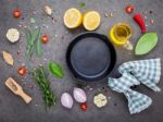 Empty Old Cast Iron Skille On Dark Stone Background. Ingredients Stock Photo