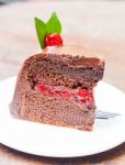 Piece Of Chocolate Cake On White Plate Stock Photo