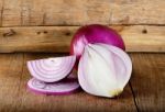 Red Onion On The Wooden Background Stock Photo