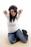 Top View Of Pointing Woman Wearing Headphone Stock Photo