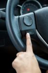 A Woman Hand Pushes The Mode Hold Control Button On A Steering Wheel Stock Photo